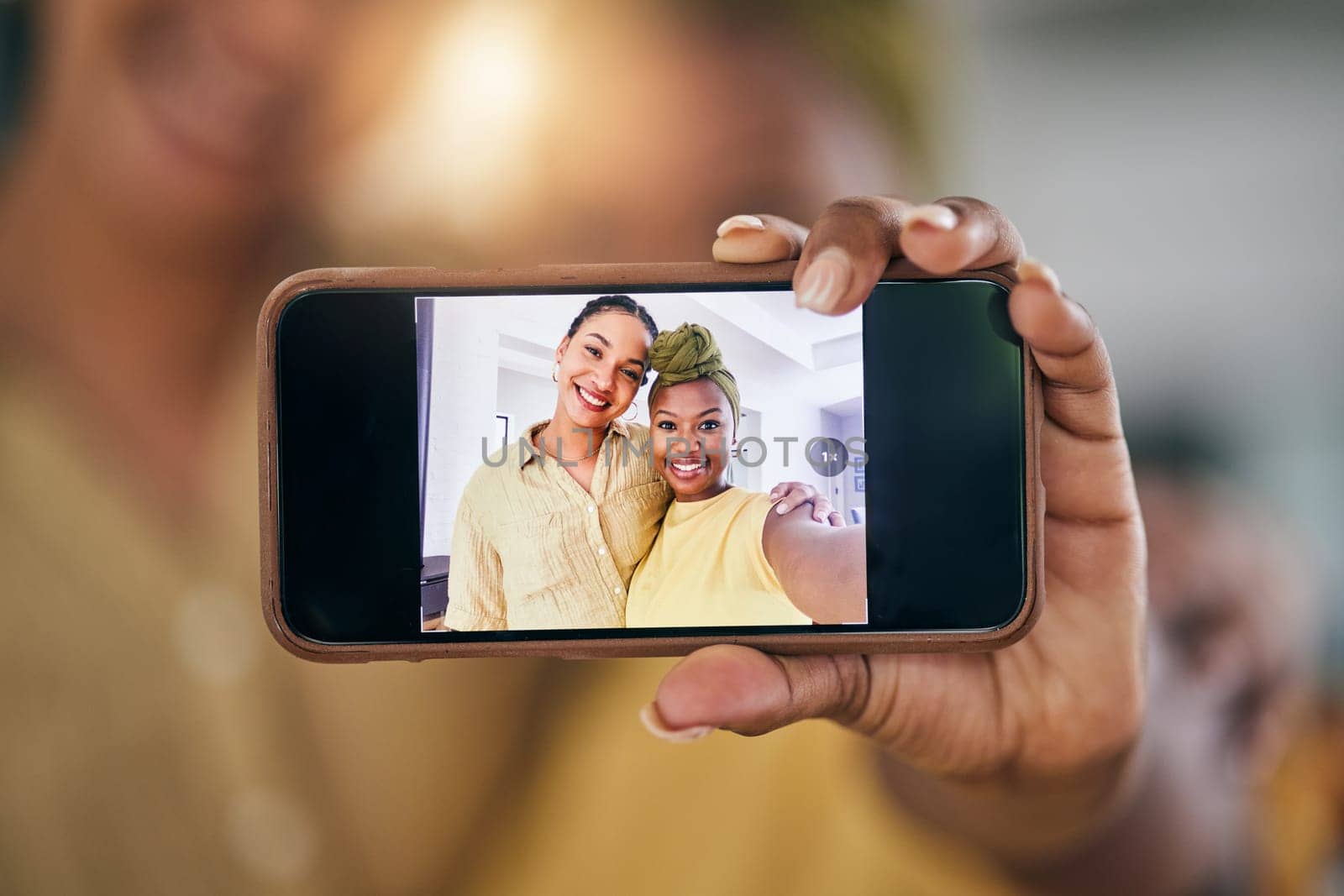 Lesbian couple, women and selfie with phone screen in home in portrait, post and web blog in living room. African girl, photography and memory with profile picture, lgbtq or social media app in house.