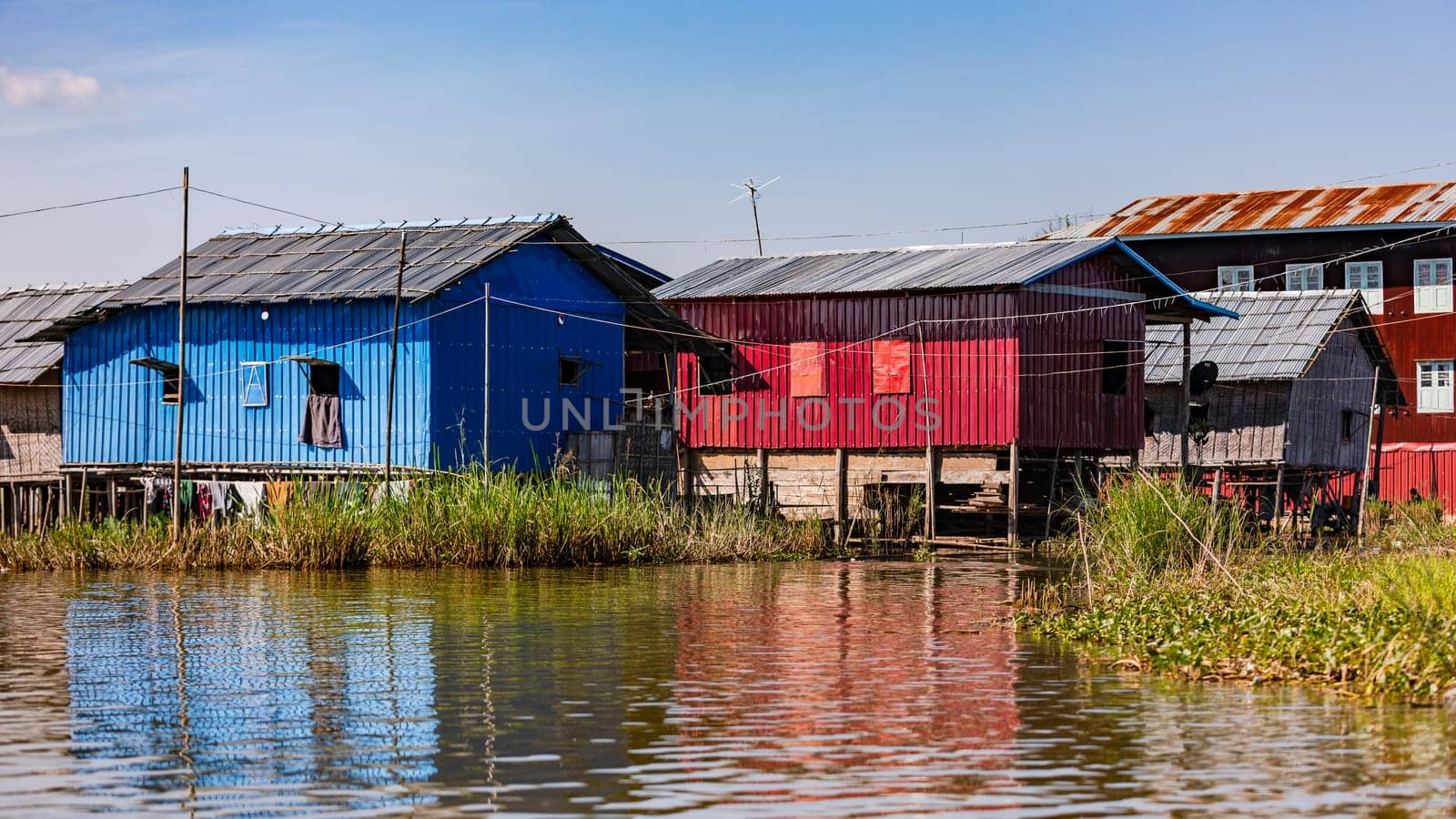 Traditional simple houses on stilts in the idyllic Inle Lake are a tourist destination in Myanmar, Asia