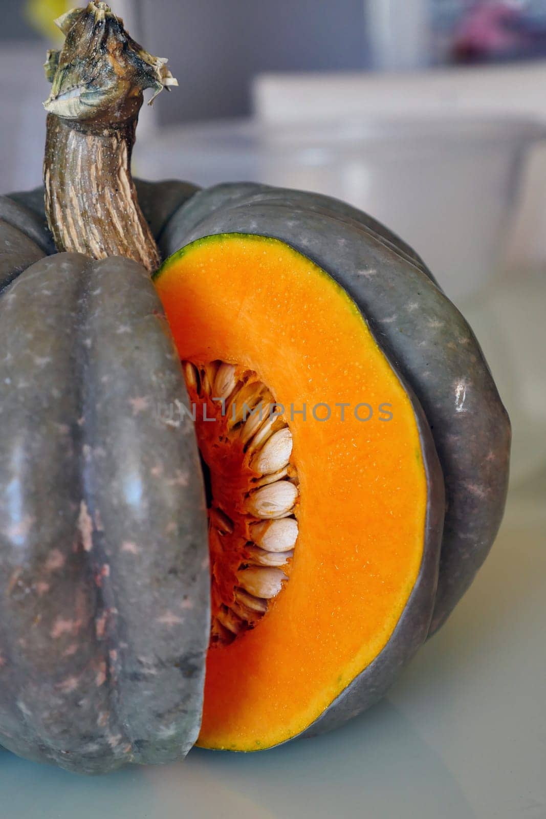 slice the organic pumpkin with a knife, by nhatipoglu