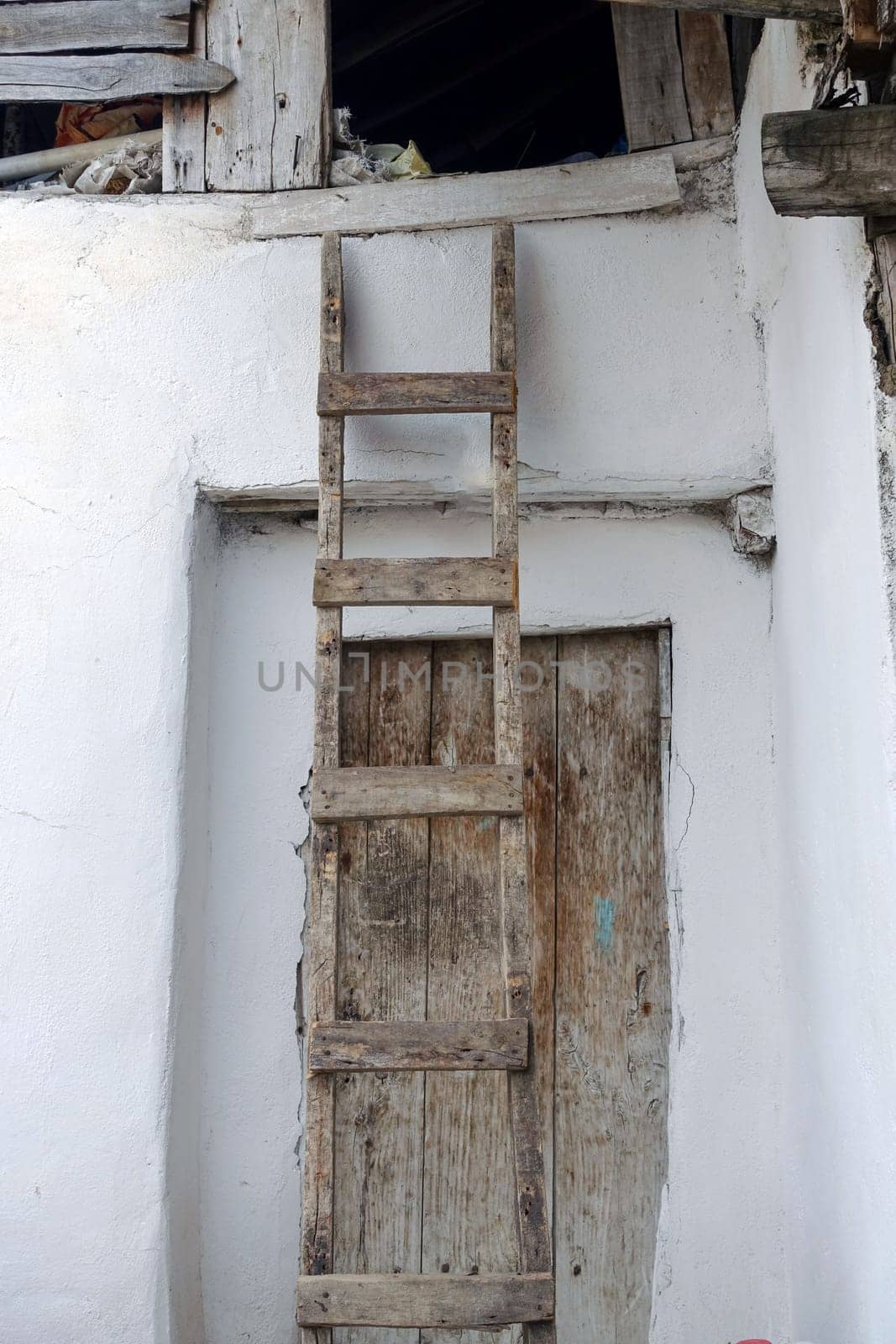classic handmade wooden ladder for climbing on the roof, by nhatipoglu