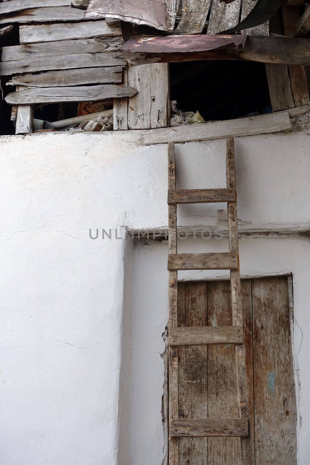 classic handmade wooden ladder for climbing on the roof,