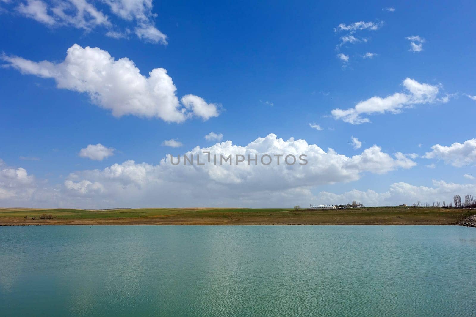 wonderful spring landscape of sky lake and clouds,clouds reflecting in water,