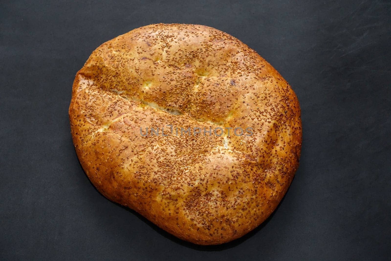 Pita with sesame seeds in Ramadan, pita bread in Turkish culture, Ramadan and pide, by nhatipoglu