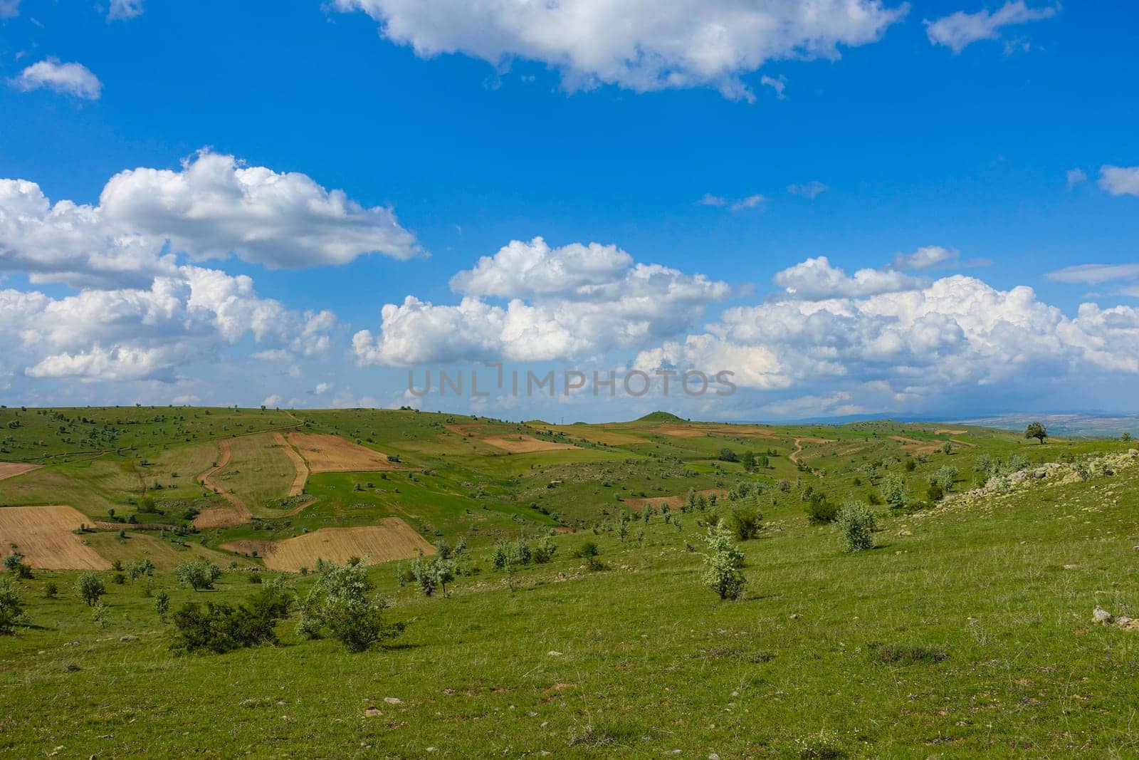 cloudy sky and green landscape, wonderful spring views, green field and hill plateau view,