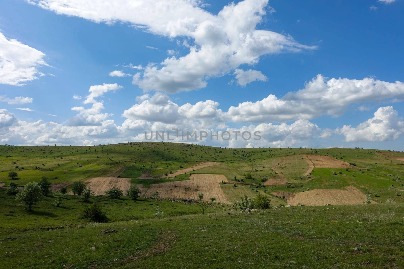 cloudy sky and green landscape, wonderful spring views, green field and hill plateau view,