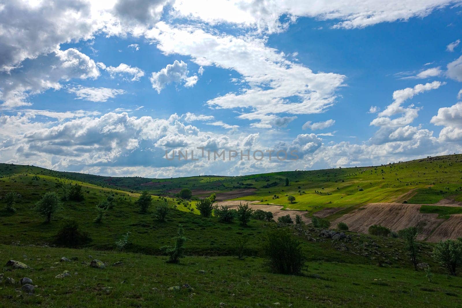 cloudy sky and green landscape, wonderful spring views, green field and hill plateau view,