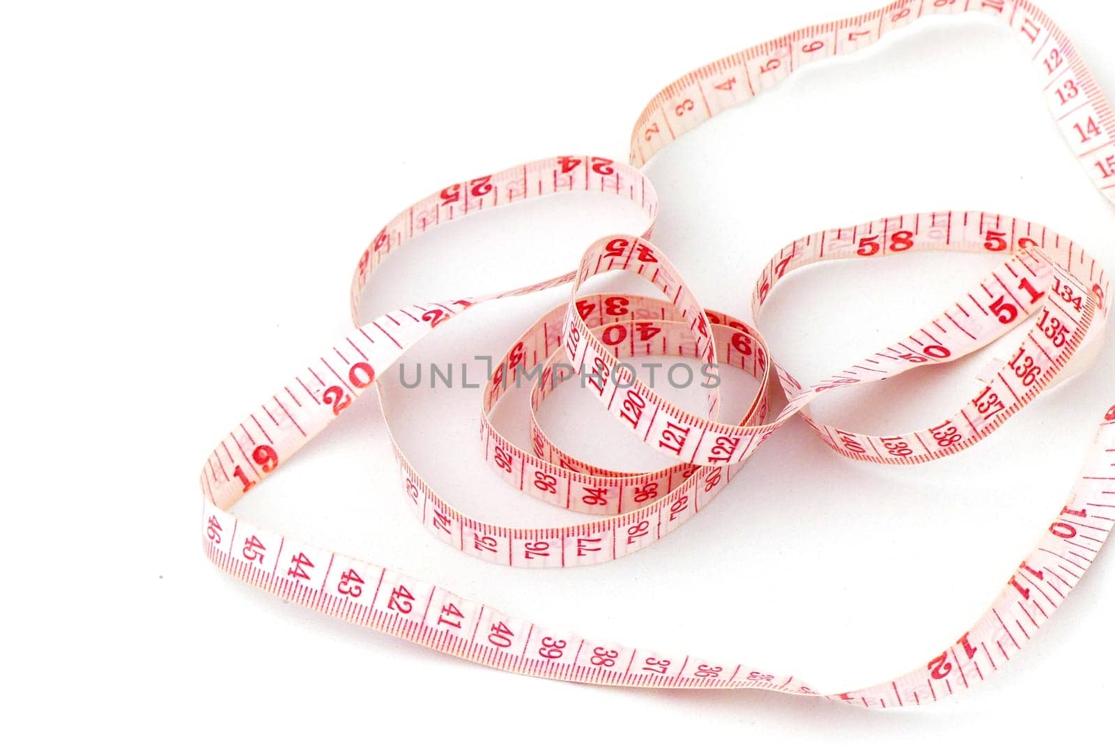 close-up tailor's tape measure,rope tape measure on a white background,