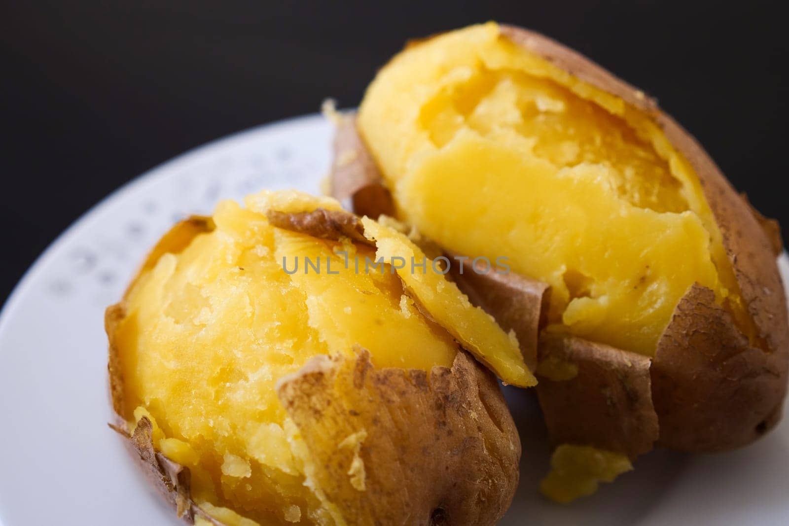 close-up of boiled whole potatoes in the plate,boiled large potatoes with the peel, by nhatipoglu