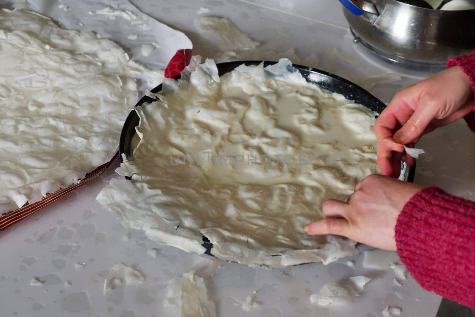 Turkish Dessert Güllaç, A Woman Making Güllaç Dessert,Turkish Dessert Made in Ramadan, Güllaç with Milk, by nhatipoglu