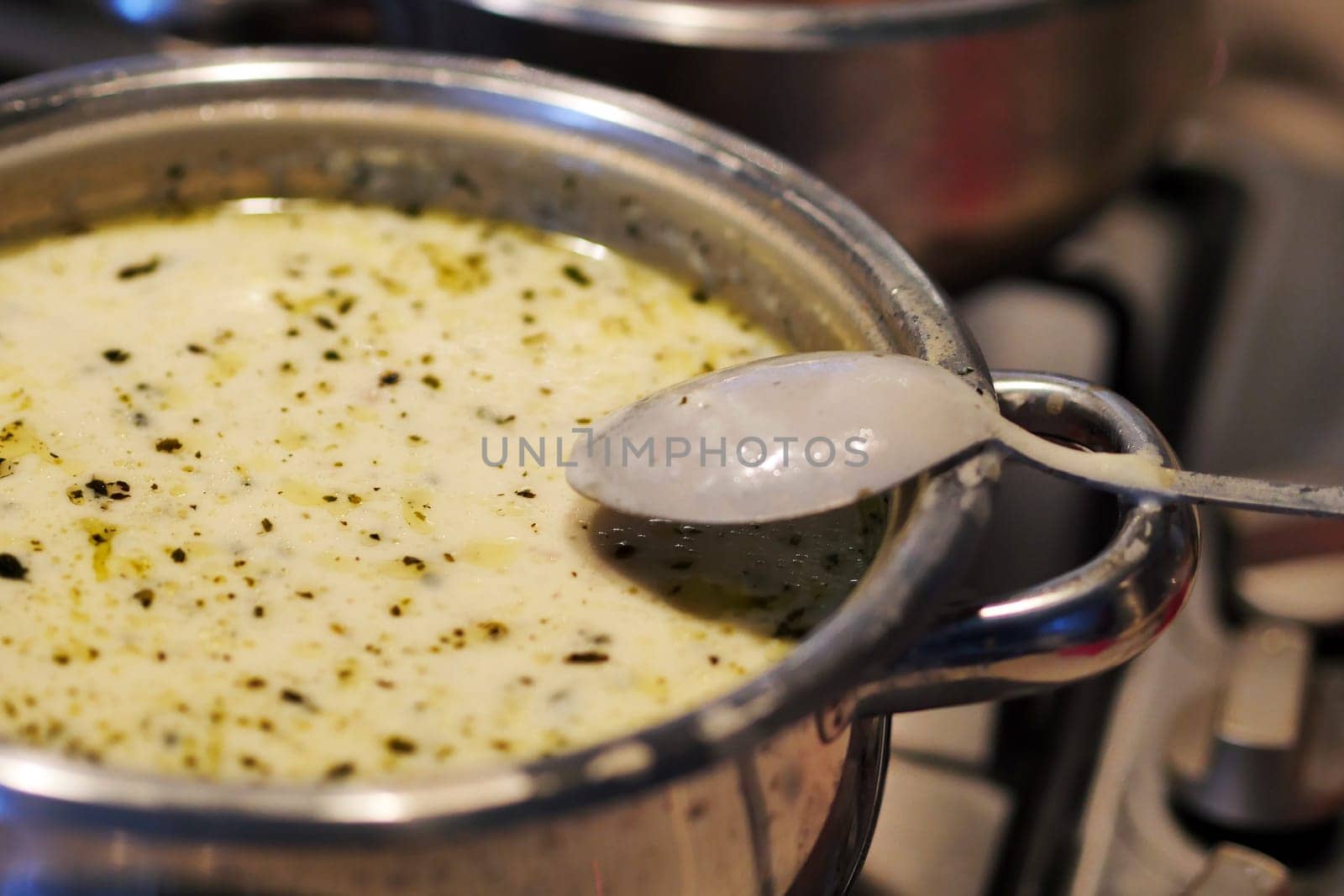 Boiling yoghurt soup on a freshly cooked stove, very hot yoghurt soup, highland soup,