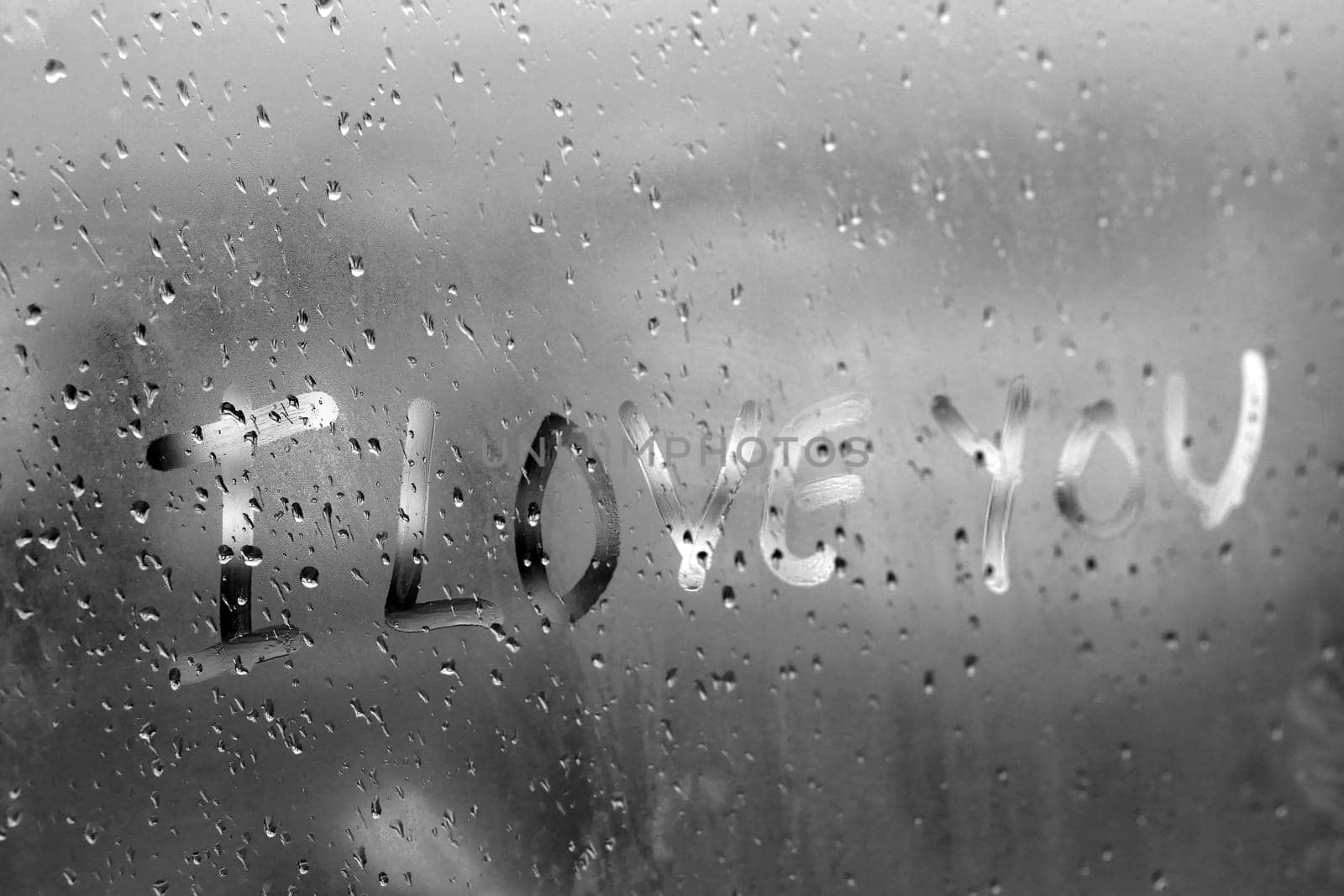 "I love you" written on fogged glass,