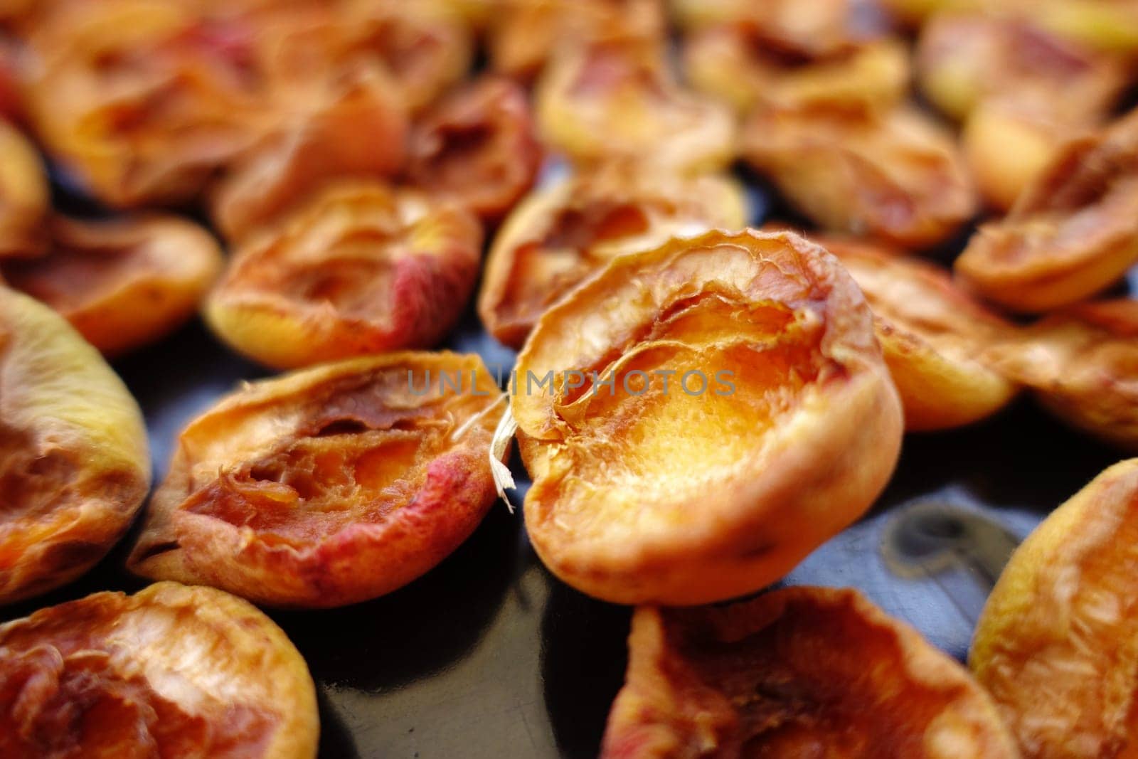 drying apricots in the sun, fruit drying, dried apricots, natural apricot drying,