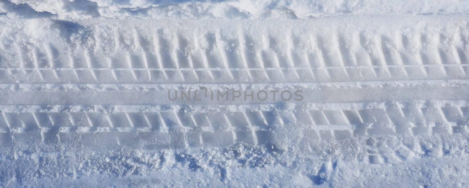 car tire marks on the snow, tire marks on the snow,