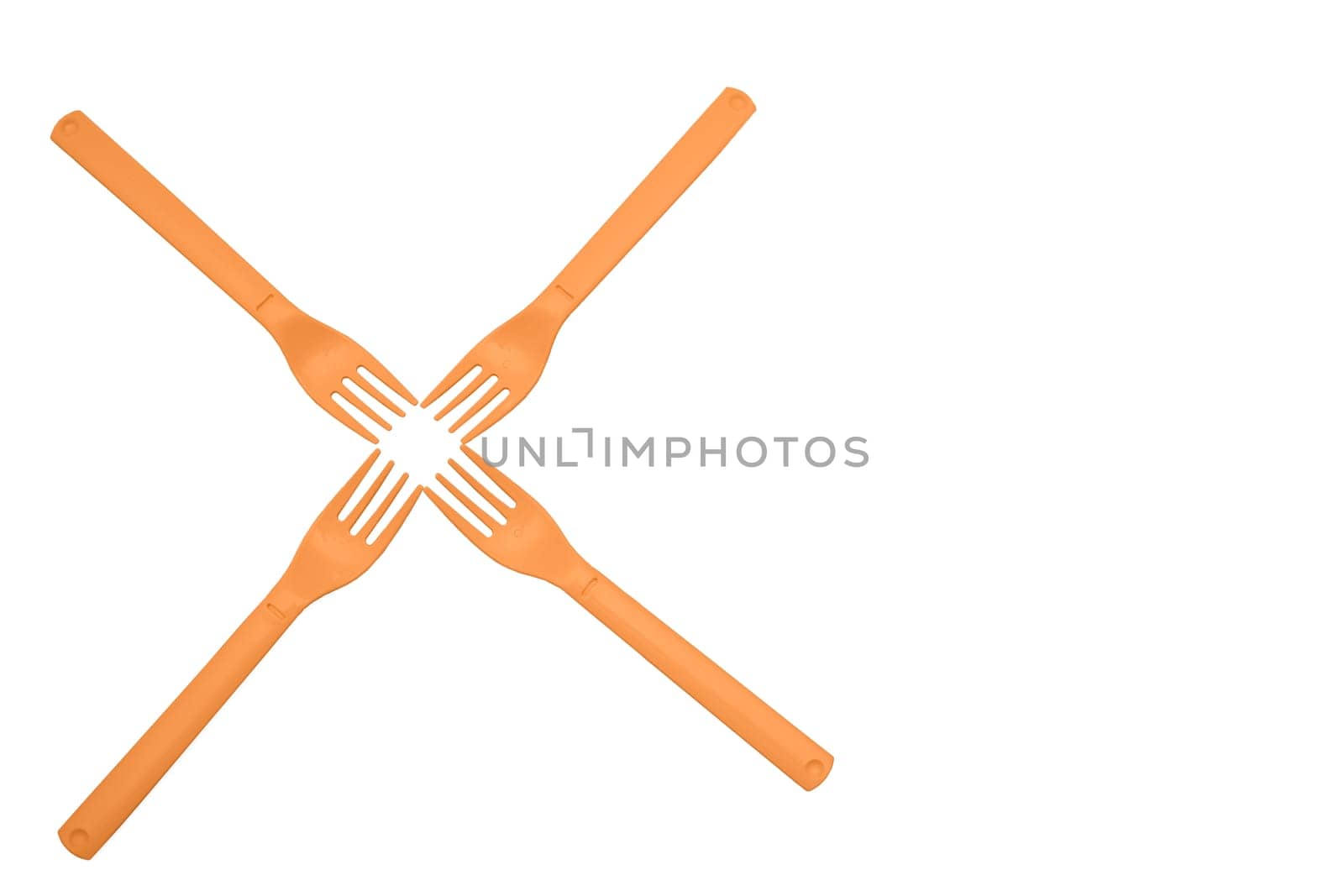 Four orange plastic forks for camping, travel isolated on white surface by jovani68