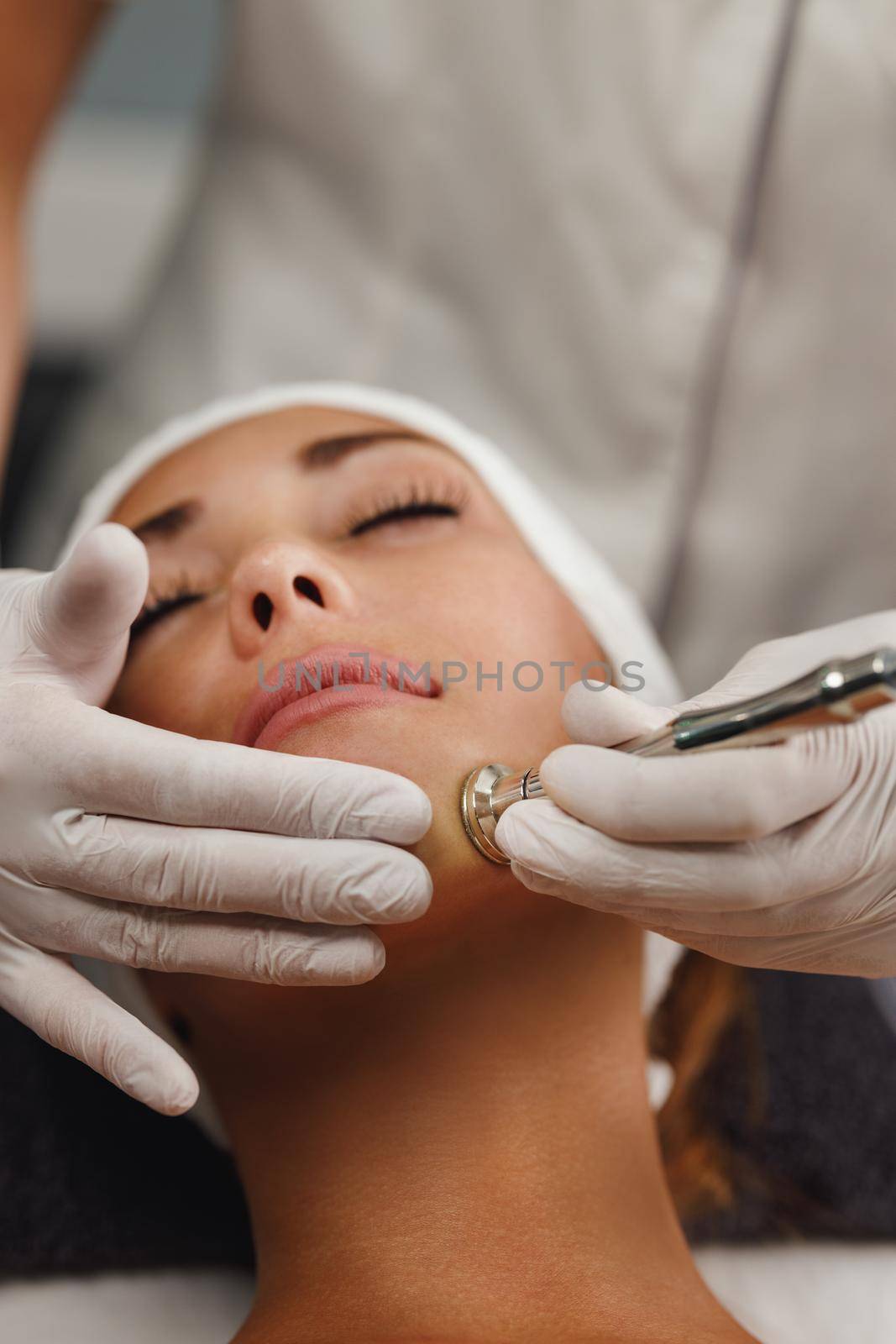 Shot of a beautiful young woman on a facial treatment at the beauty salon.