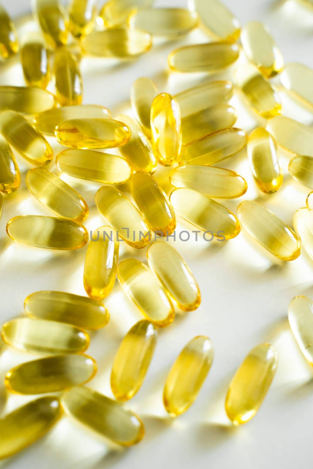 Fish oil, omega 3 supplement capsule over white background. Healthy Vitamins