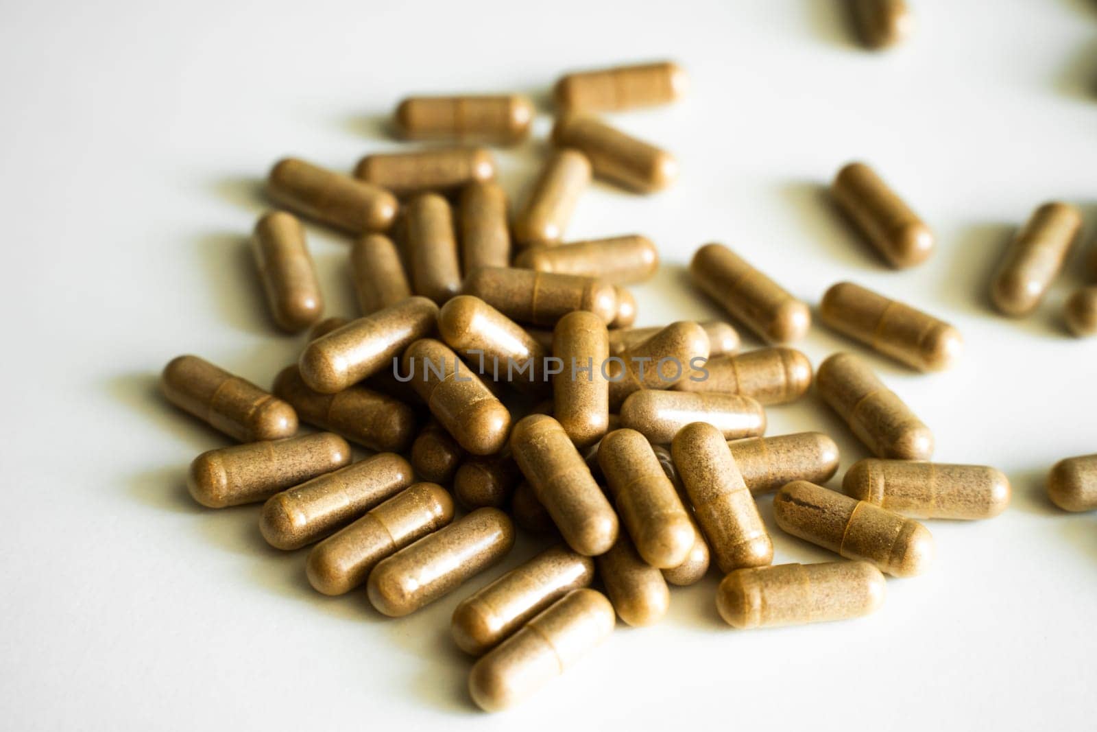 Brown tablets, pills, capsule of iron supplements. Health medication. Iron concept. Ferrum inscription. Medical supplies. Close-up