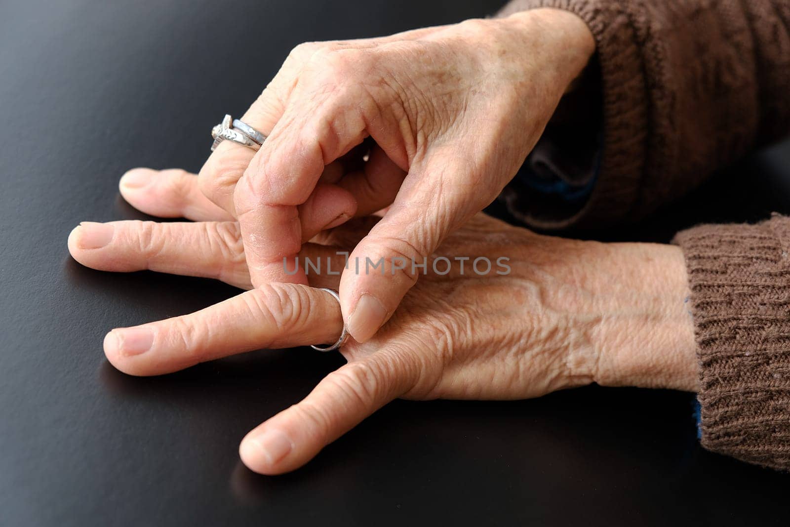 elderly woman's hand with a ring on her finger, old woman's hand and fingers, by nhatipoglu