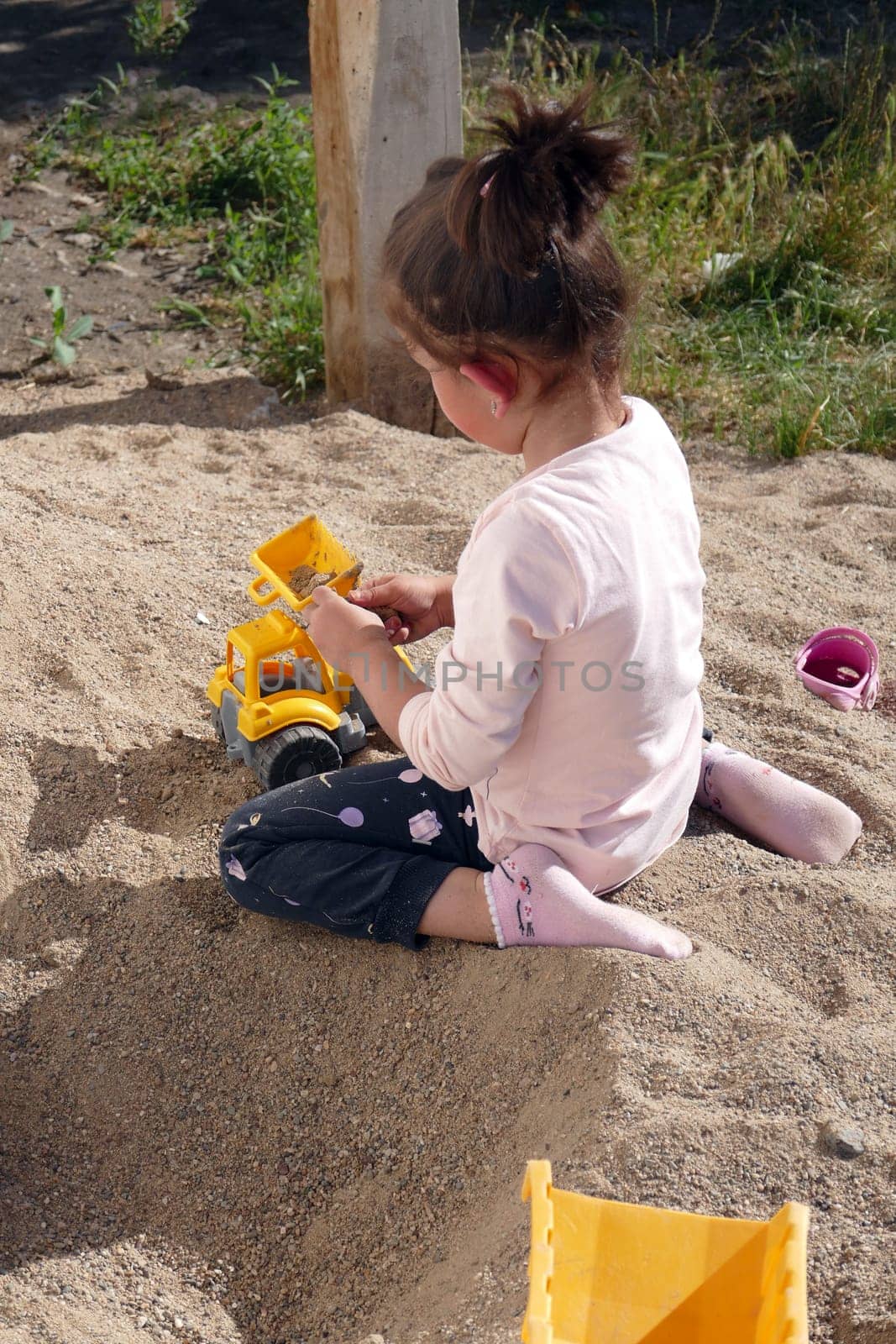 children playing in the sand, happy children playing in the sand in the garden, by nhatipoglu