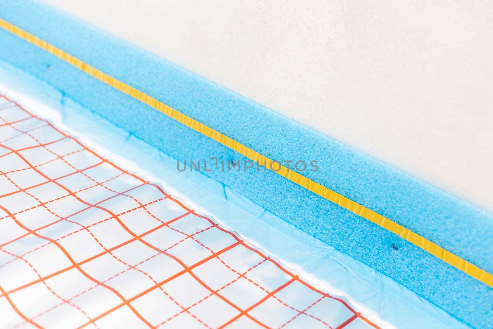 Expansion tape for the underfloor heating between floor and wall with reflective film for underfloor heating, concept of heated floor
