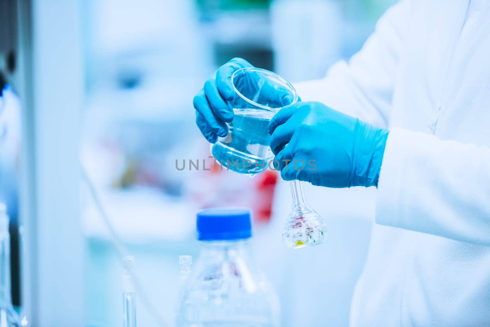 Pharmacist making medicines in a laboratory, pharmacy production concept