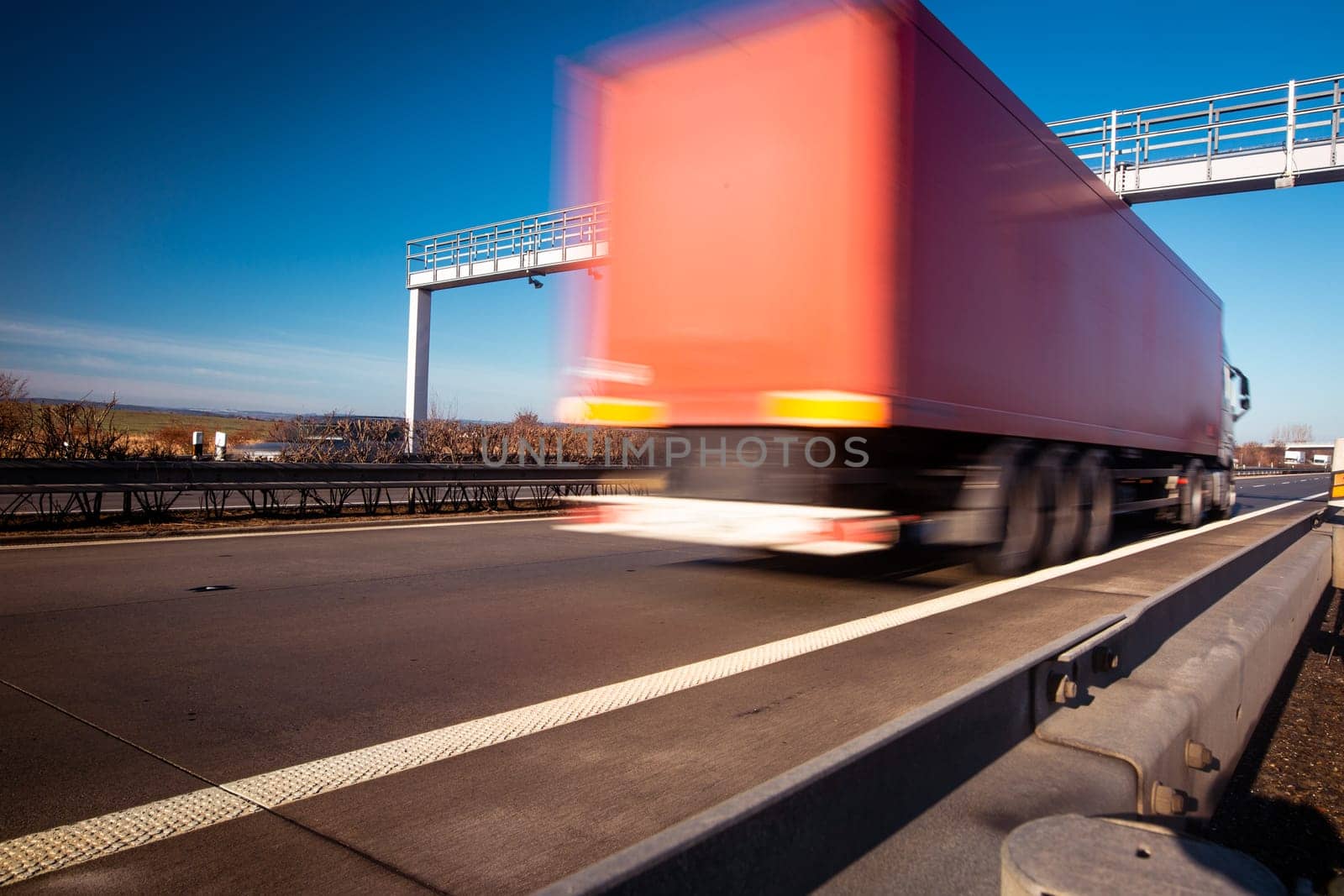 Trucks passing through the toll gate on the highway, highway fee, industrial and transport concept