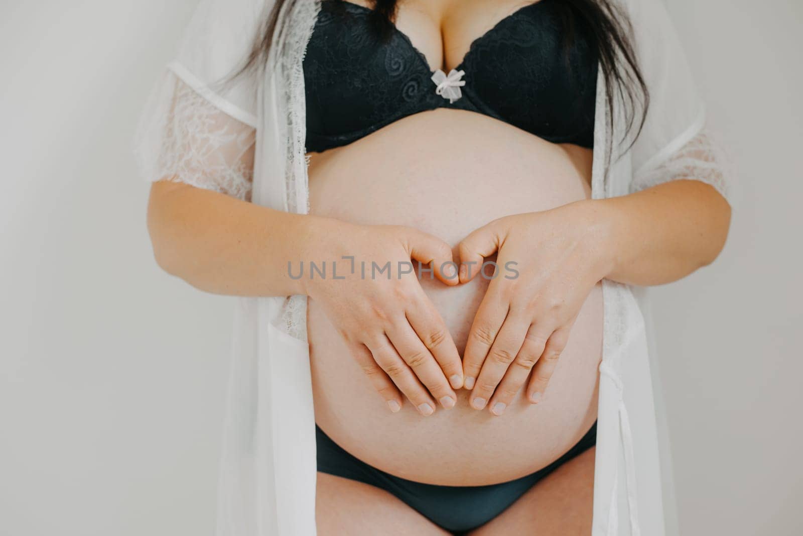 Young pregnant woman with belly, a pregnancy concept