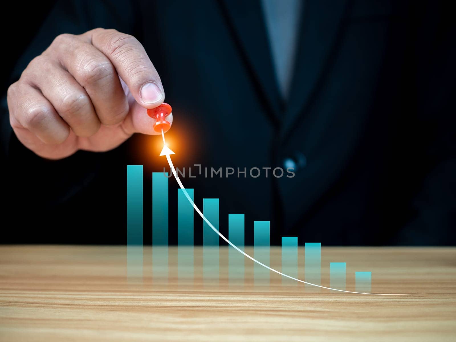 Stock trading. Finance. Investing. Growing business. Businessman in suit showing finger pointing to arrow tip on gray background.