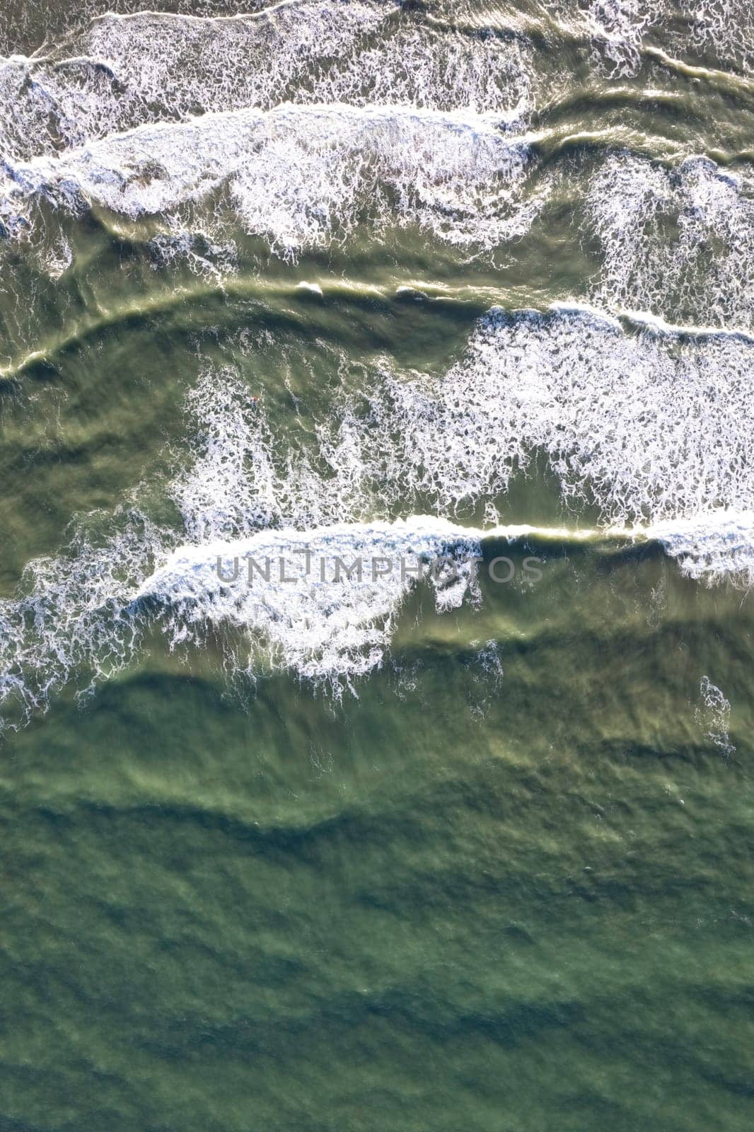 Aerial shot of the sea on a stormy day  by fotografiche.eu