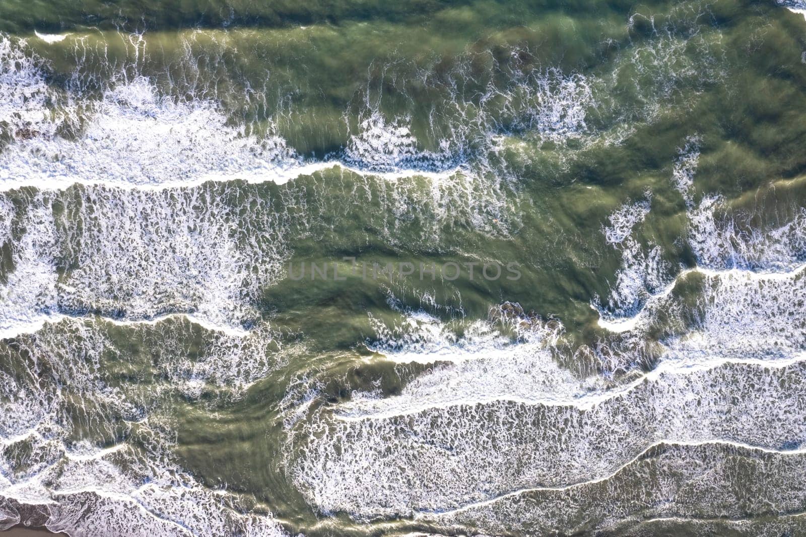 Aerial shot of the sea on a stormy day  by fotografiche.eu