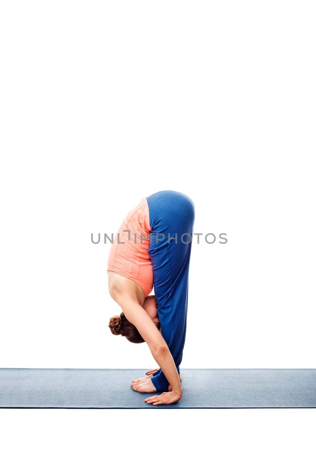 Woman doing Ashtanga Vinyasa Yoga Surya Namaskar Sun Salutation asana uttanasana - standing forward bend of pose posture isolated on white background