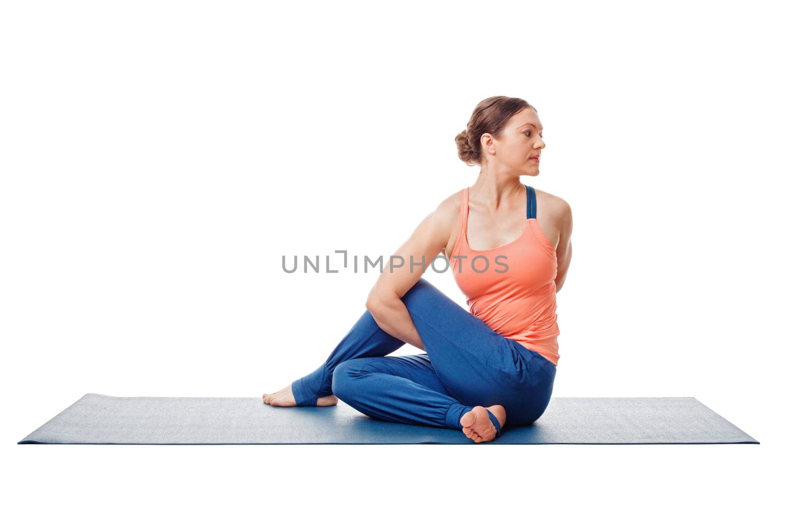 Woman doing Ashtanga Vinyasa Yoga asana Marichyasana D - sitted spinal twist pose posture easy variation isolated on white background