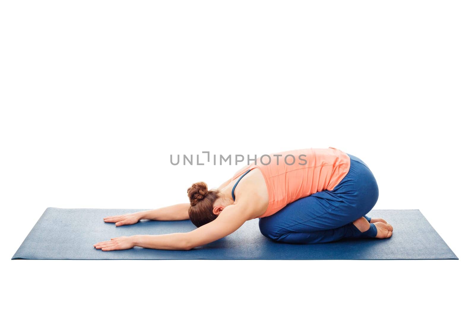 Woman doing Ashtanga Vinyasa Yoga relaxation asana Balasana - child posture - resting pose or counter asana for many asanas isolated on white background