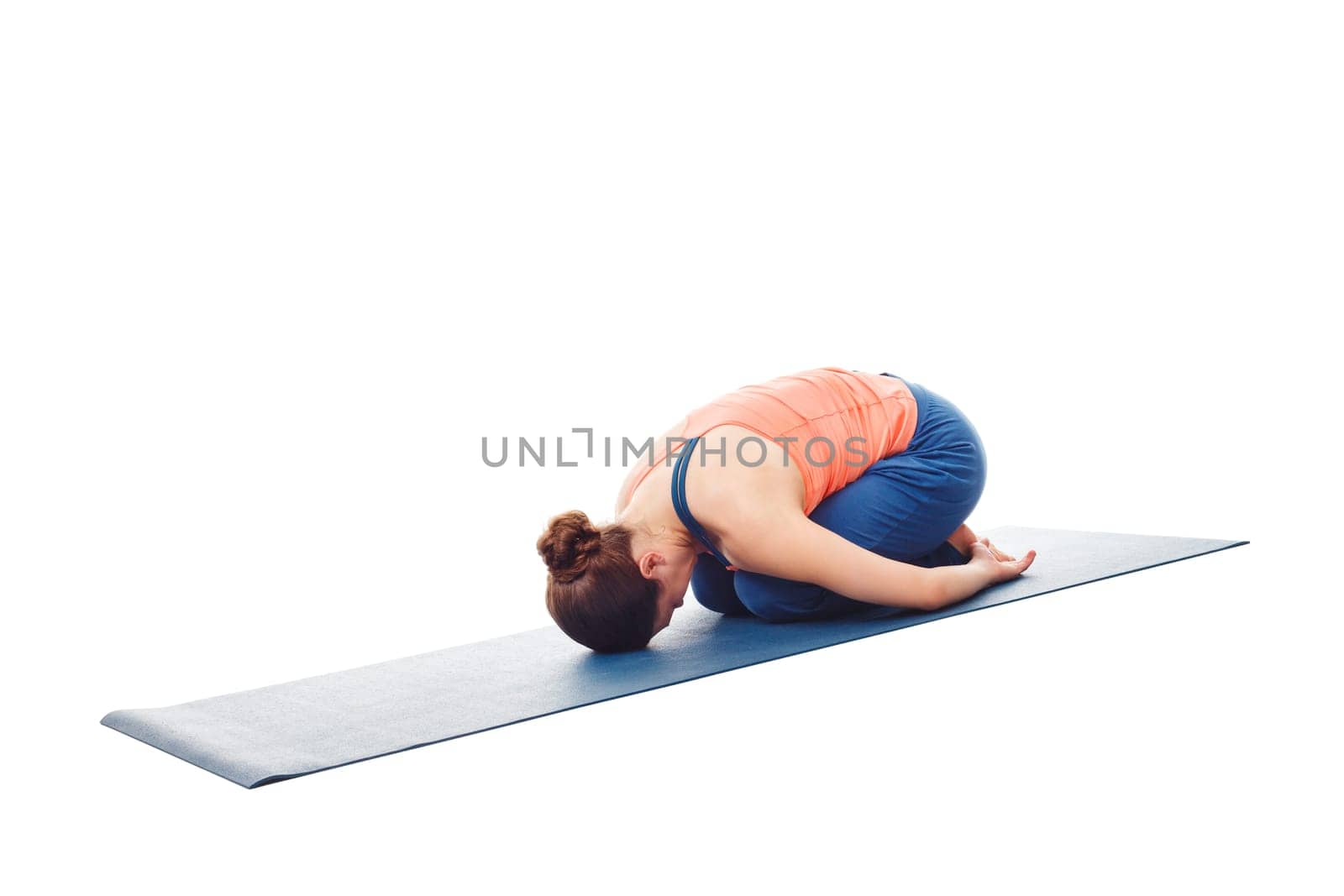 Woman doing Ashtanga Vinyasa Yoga relaxation asana Balasana chil by dimol