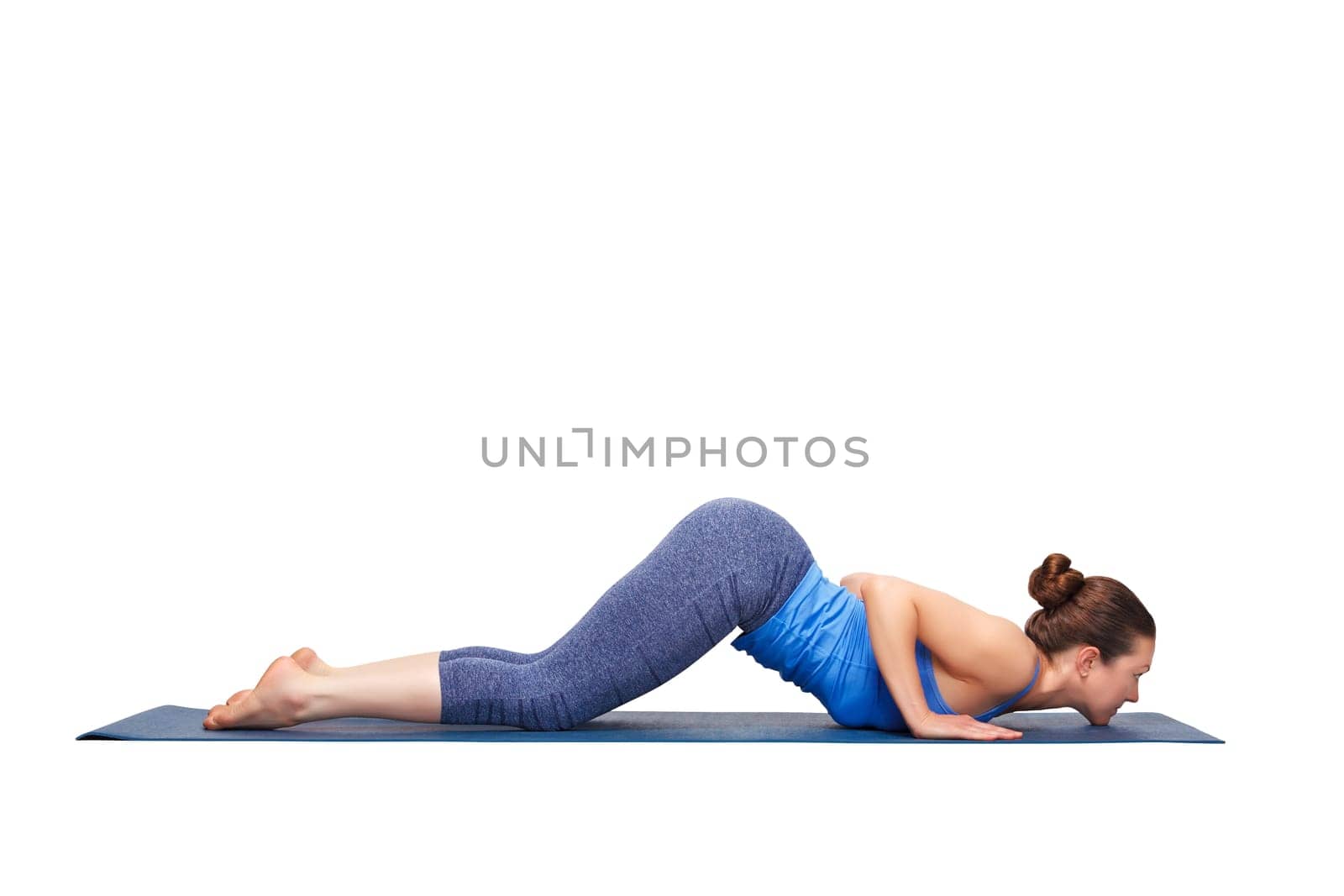 Beautiful sporty fit yogini woman practices yoga asana Ashtangasana - eight-limbed pose in studio isolated on white