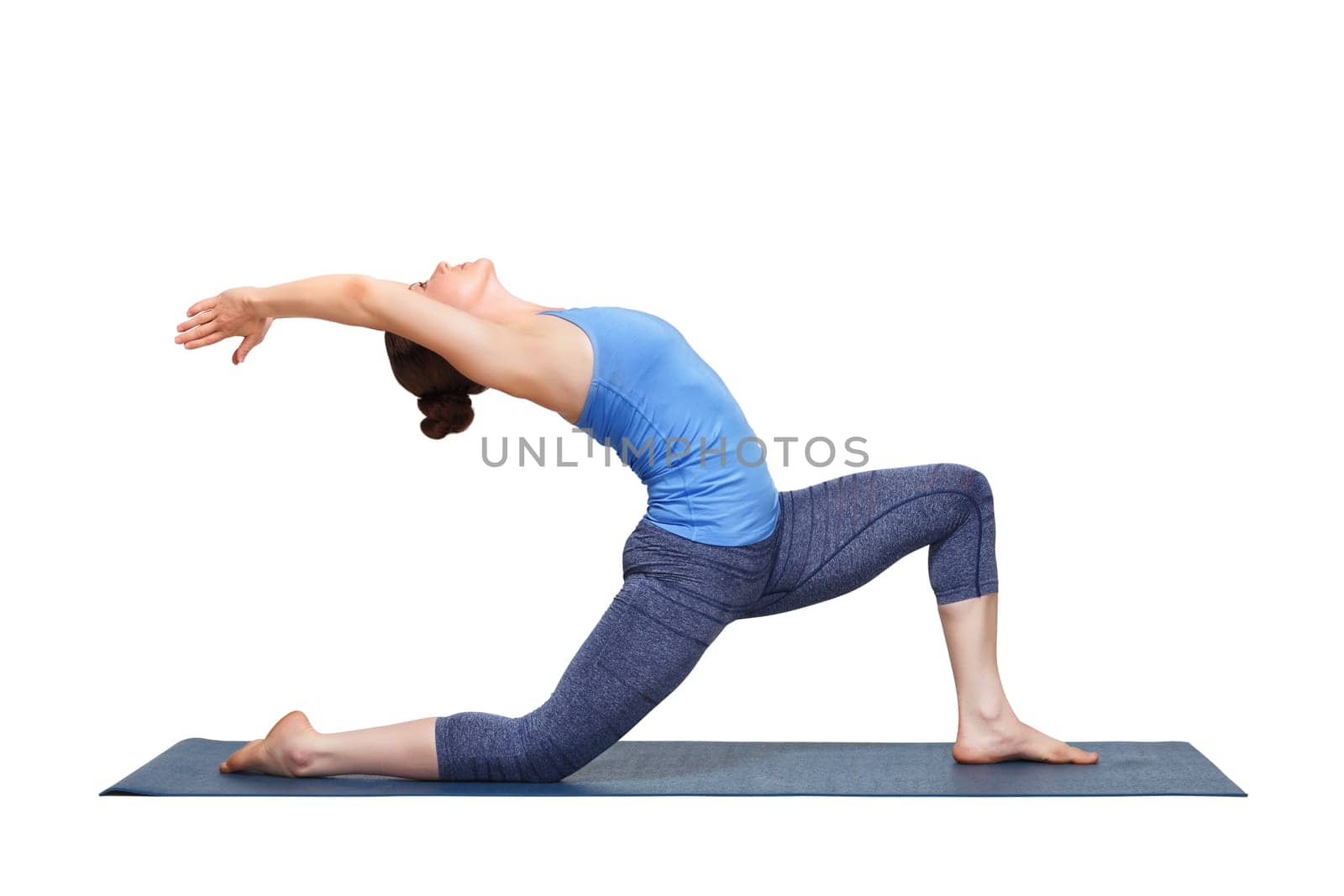 Beautiful sporty fit yogini woman practices yoga asana Anjaneyasana - low crescent lunge pose in surya namaskar in studio isolated on white