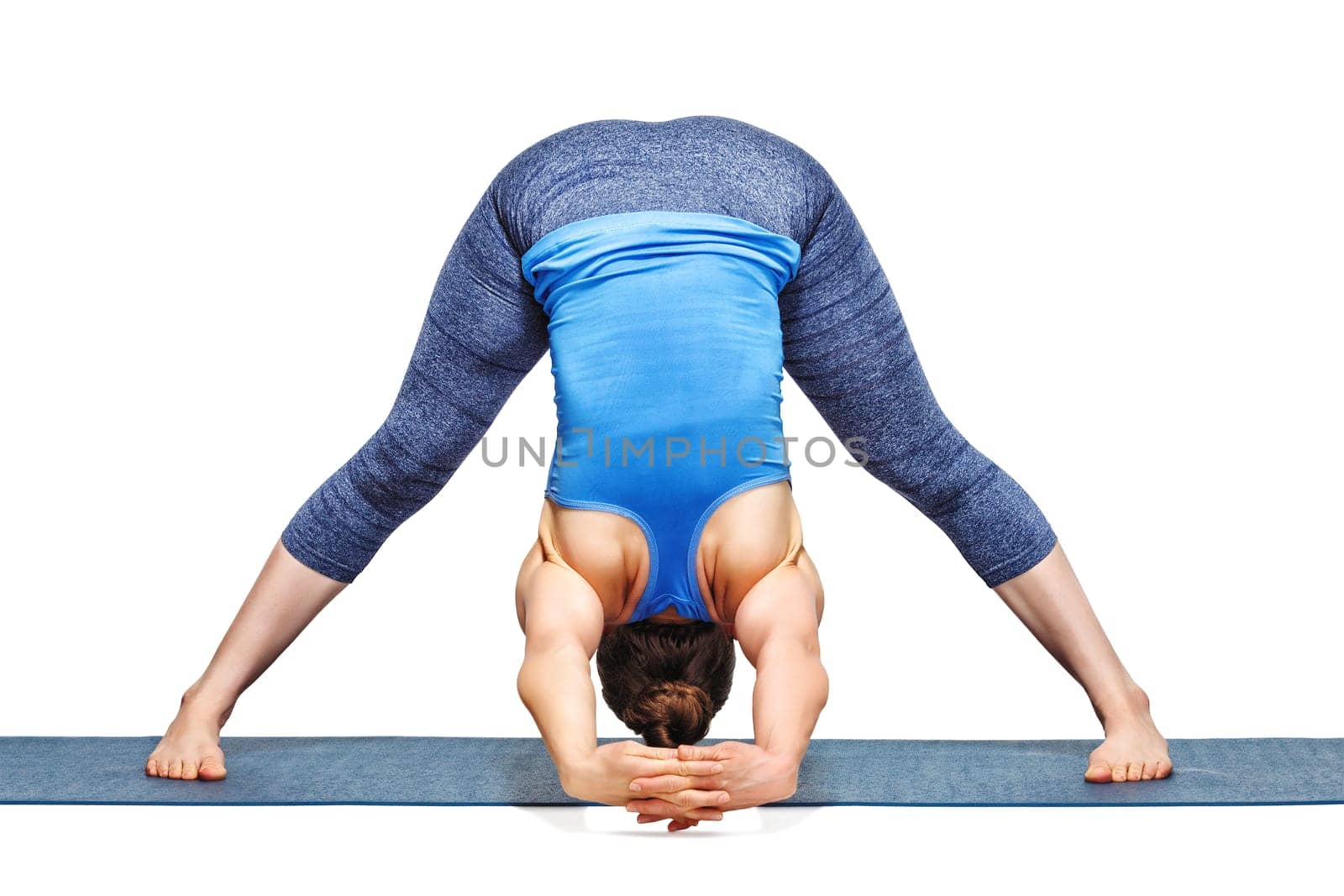 Woman practices Ashtanga Vinyasa yoga asana Prasarita padottanas by dimol