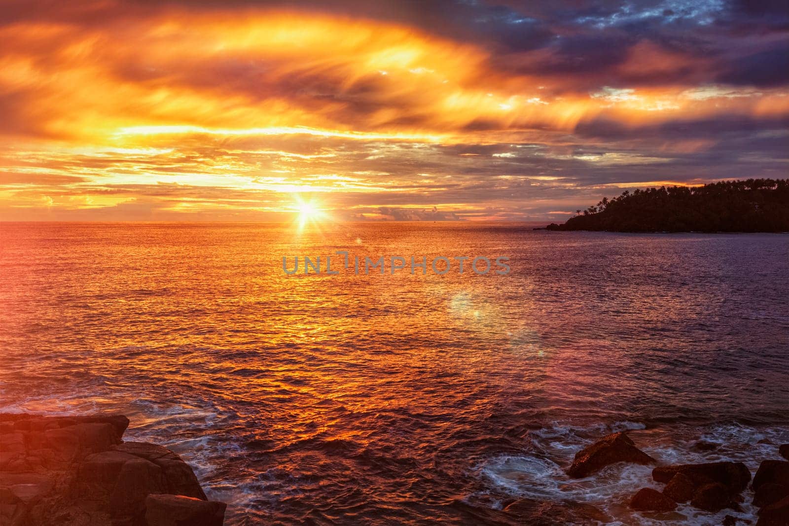 Beach resort vacation holidays background - tropical ocean sunset with dramatic sky. Mirissa, Sri Lanka