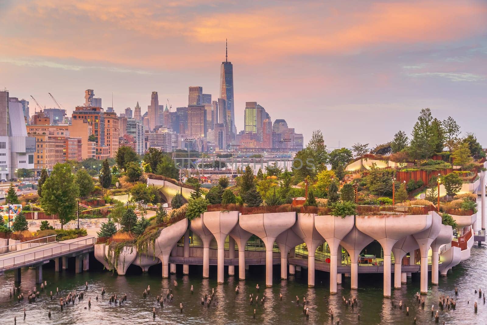 Cityscape of downtown Manhattan skyline with the Little Island Public Park in New York City at sunrise