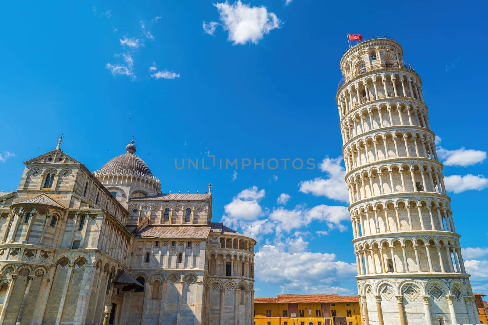 The famous Leaning Tower in Pisa, Italy with beautiful blue sky