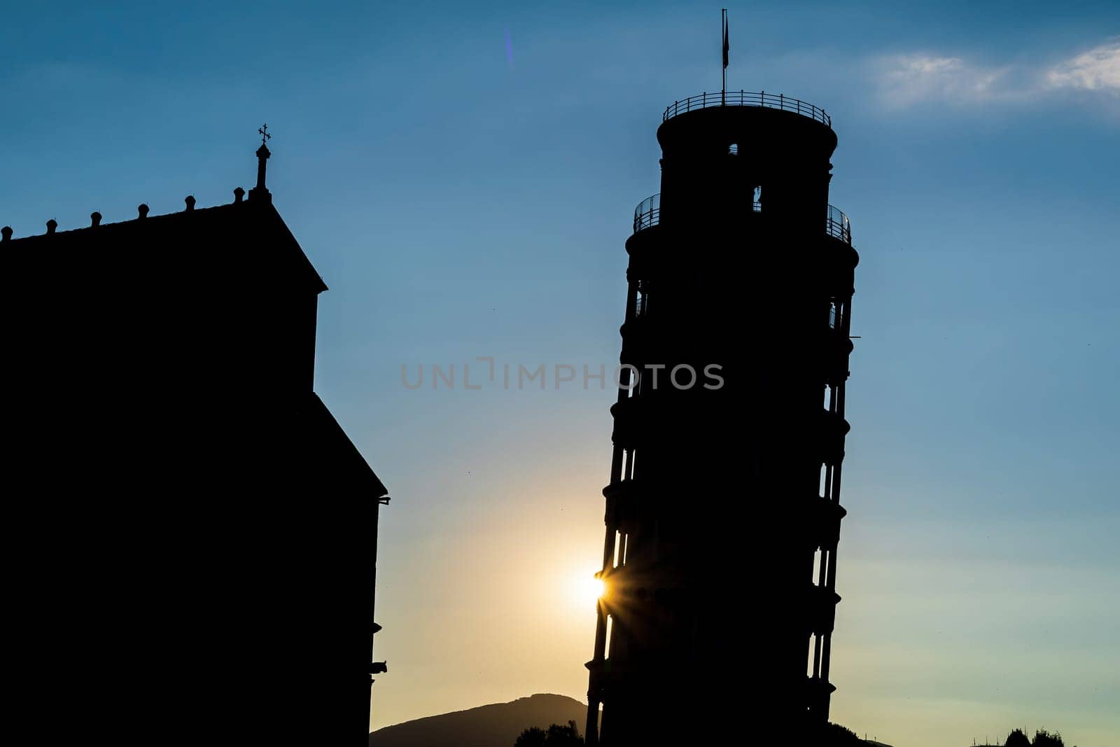 Silhouette shot of The famous Leaning Tower in Pisa, Italy with beautiful sunrise