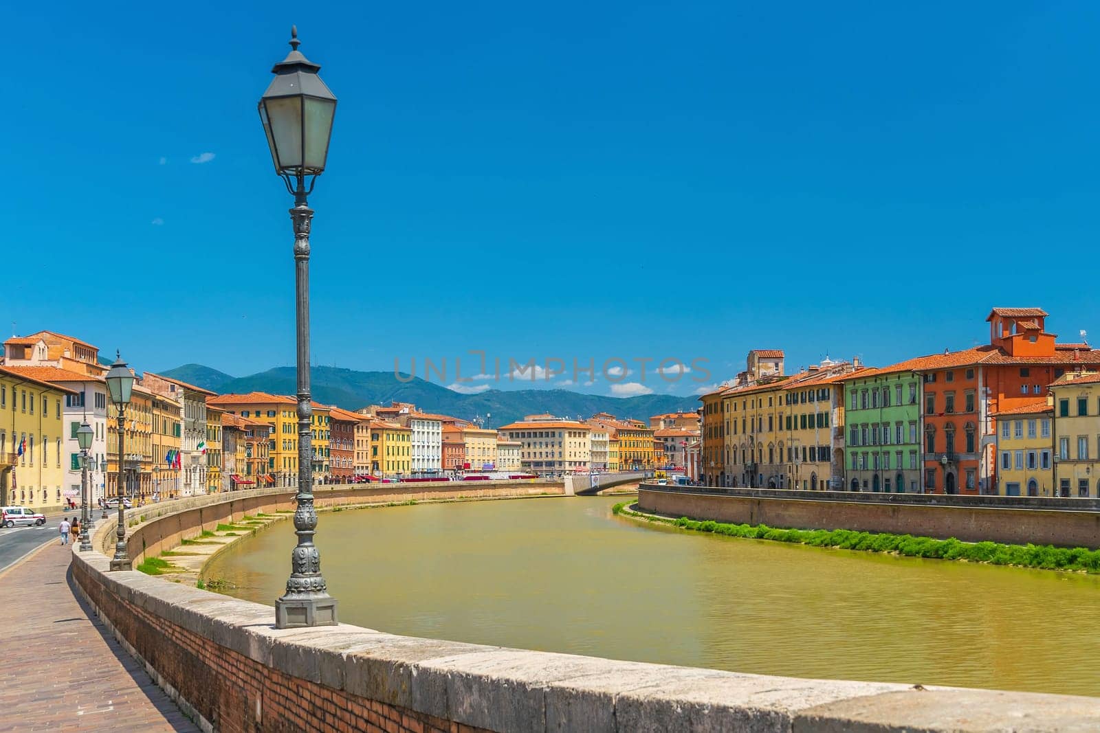 View of the medieval town of Pisa and river Arno  by f11photo