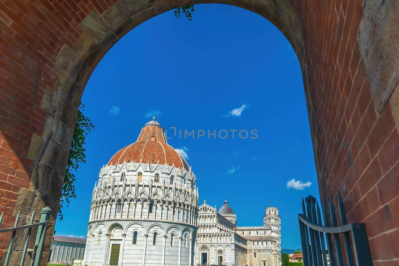 The famous Leaning Tower in Pisa, Italy with beautiful blue sky