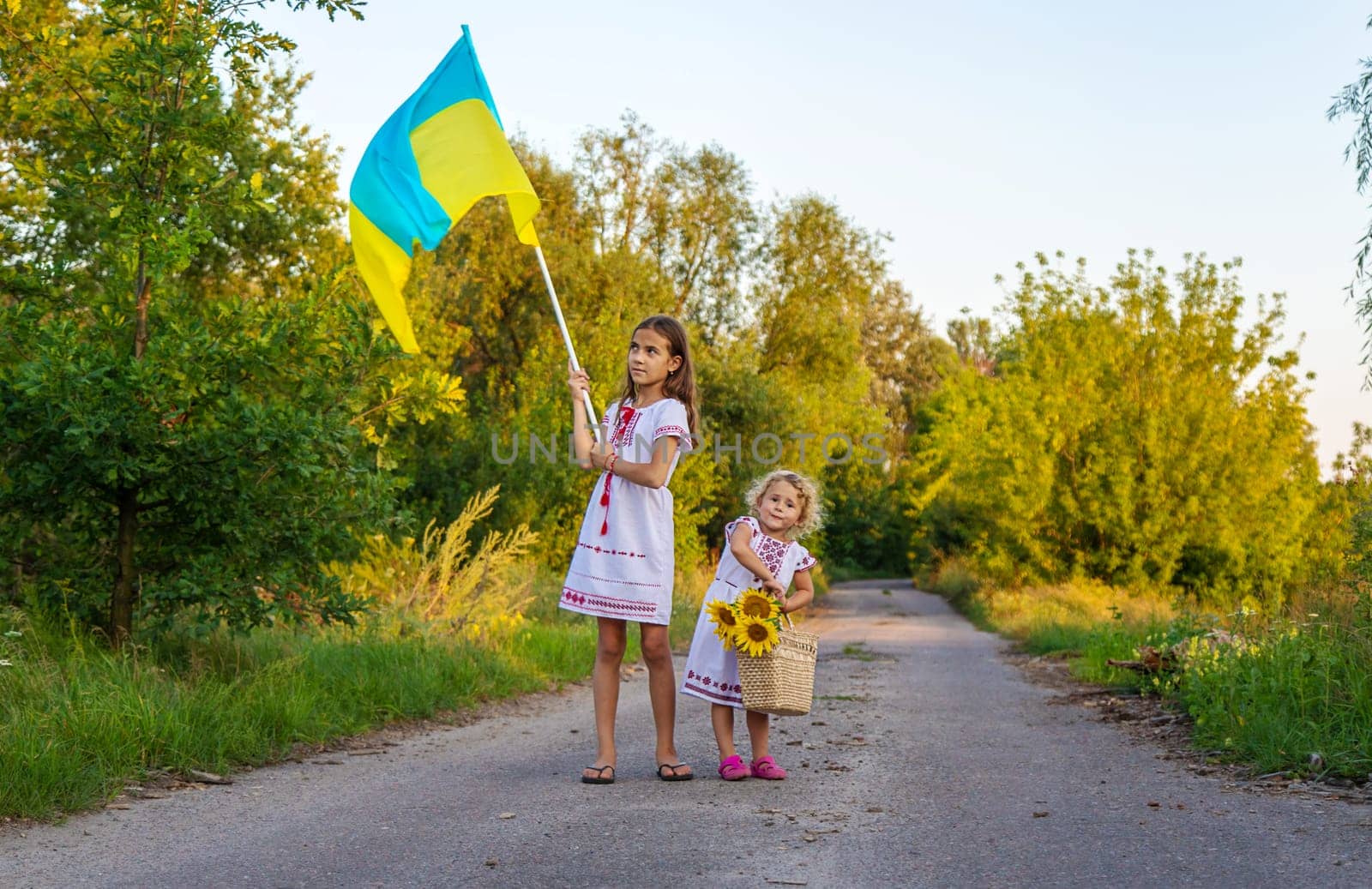 Child with the flag of Ukraine. Selective focus. by yanadjana