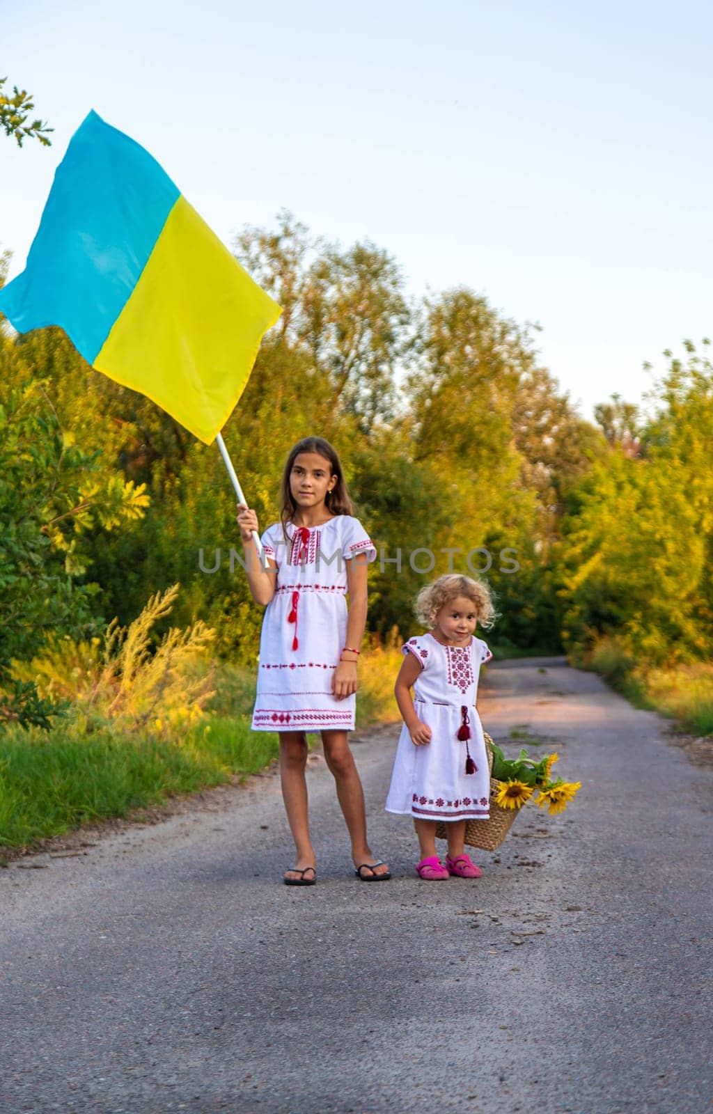 Child with the flag of Ukraine. Selective focus. Nature.