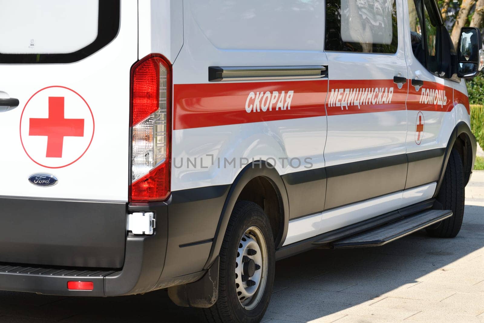 Moscow, Russia - Aug 04. 2023. An ambulance - writing on the side of the compulsory health insurance car by olgavolodina