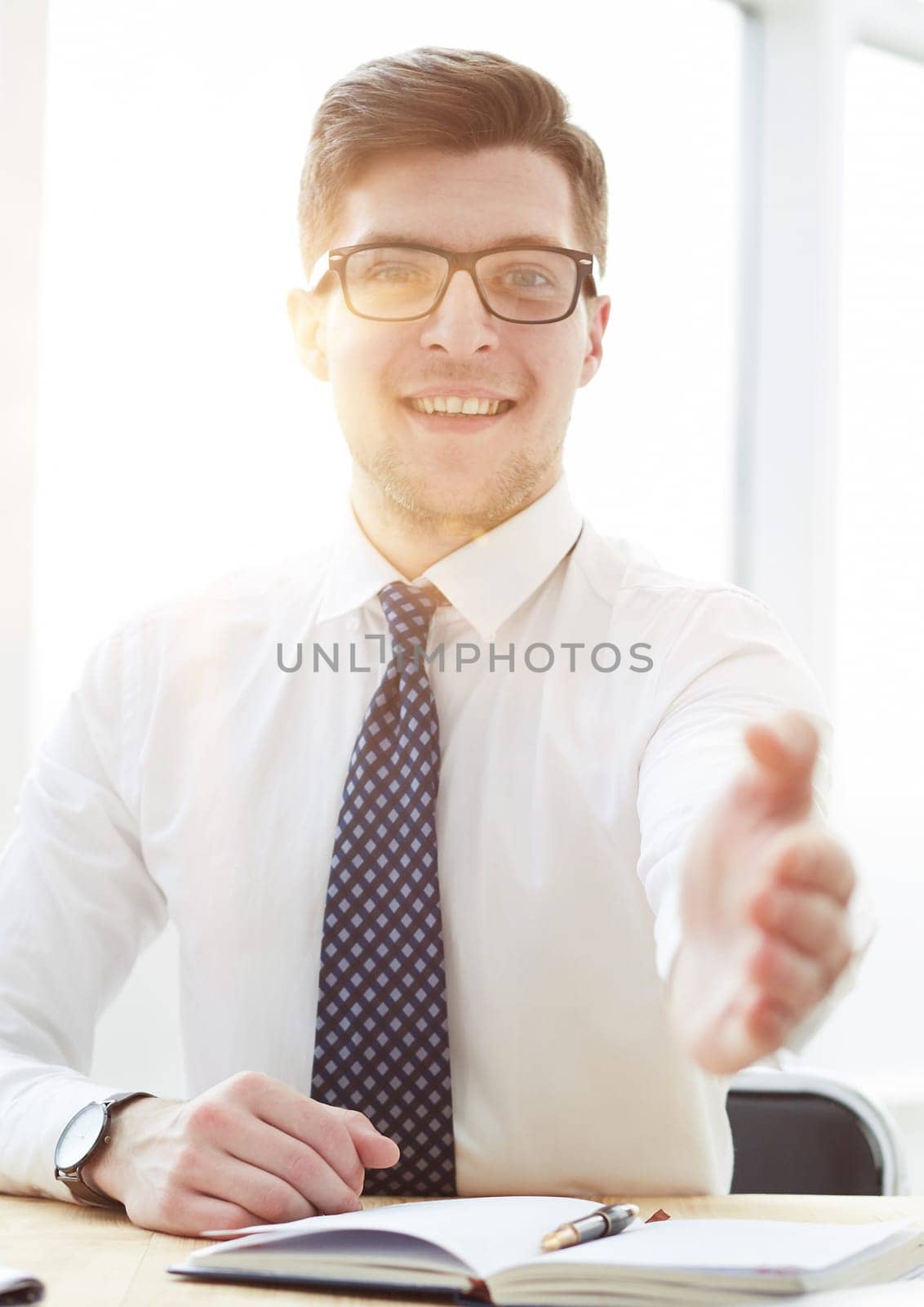 Businessman extending hand to shake by Prosto