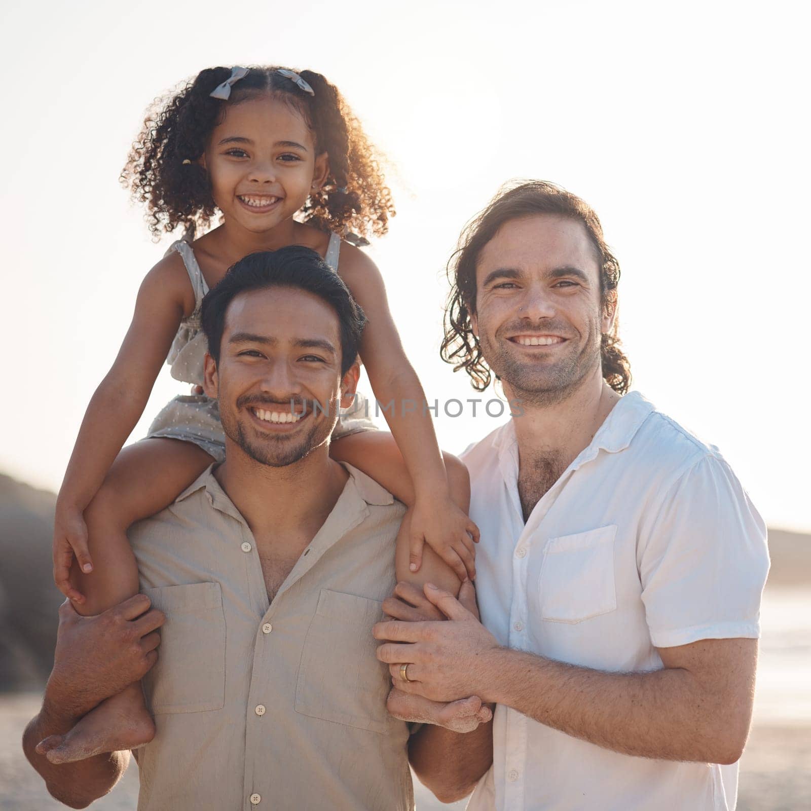 Gay couple, portrait and smile with family at beach for seaside holiday, support and travel. Summer, vacation and love with men and child in nature for lgbtq, happiness and bonding together.