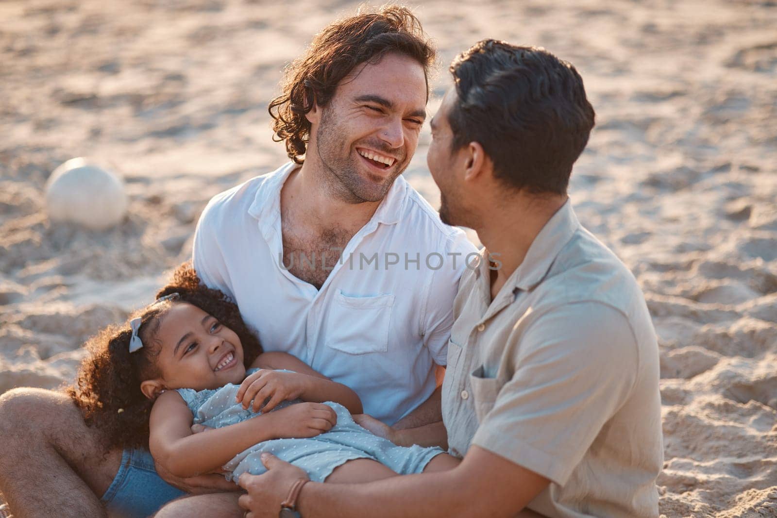 Gay couple, relax and laughing with family at beach for seaside holiday, support and travel. Summer, vacation and love with men and child in nature for lgbtq, happiness and bonding together.