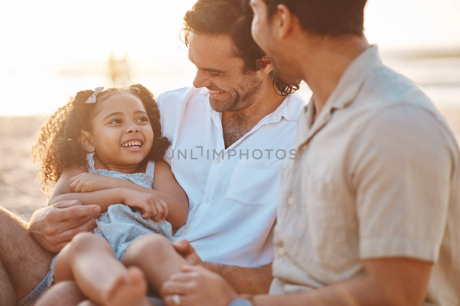 Gay couple, funny and relax with family at beach for seaside holiday, support and travel. Summer, vacation and love with men and child laughing in nature for lgbtq, happiness and bonding together.